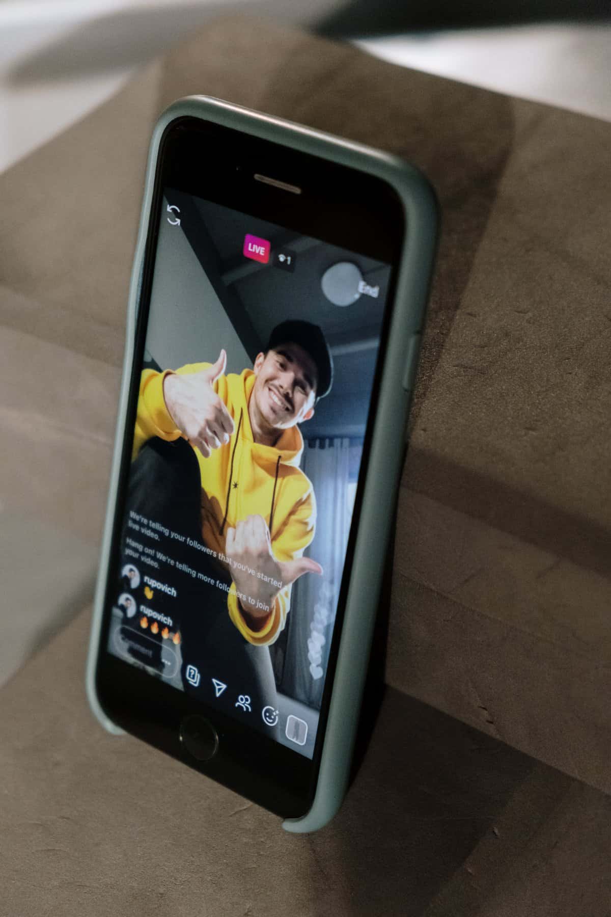 Free Man In Yellow Hoodie Sweater Doing Live In Social Media Stock Photo