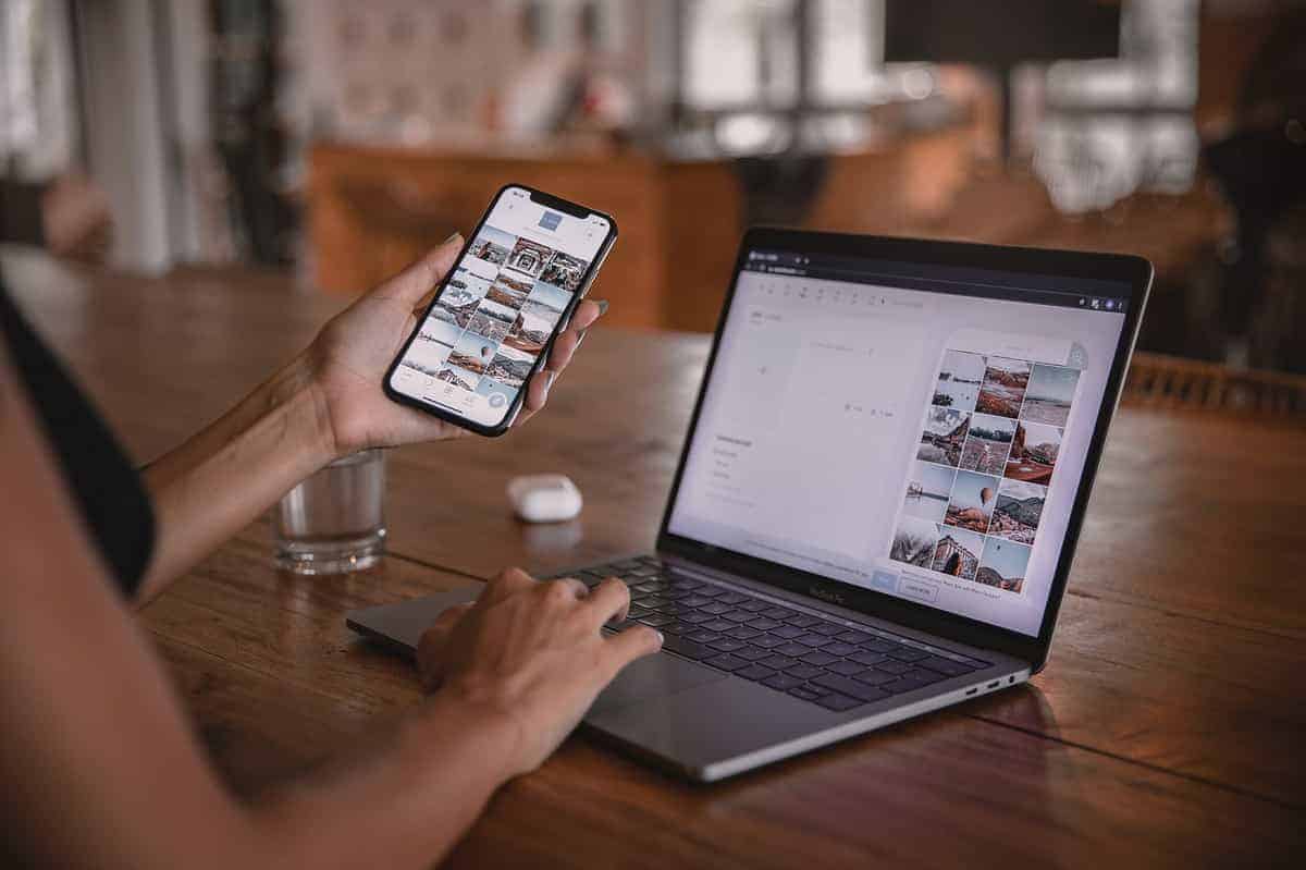 Free Woman Using Smartphone and Laptop Stock Photo